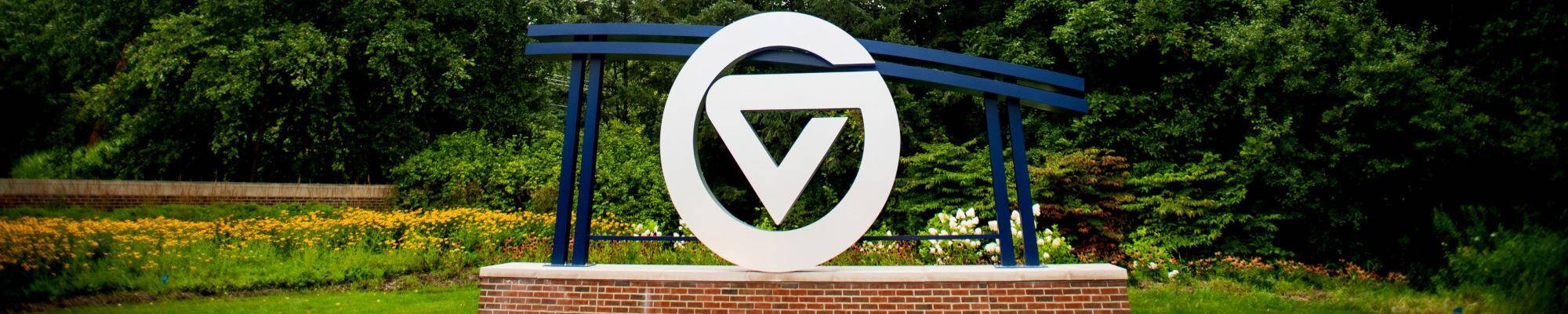 GV circle logo signage located in front of University entrance